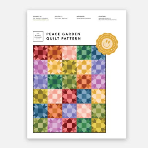 Colorful quilt pattern with a brand logo on a white background
