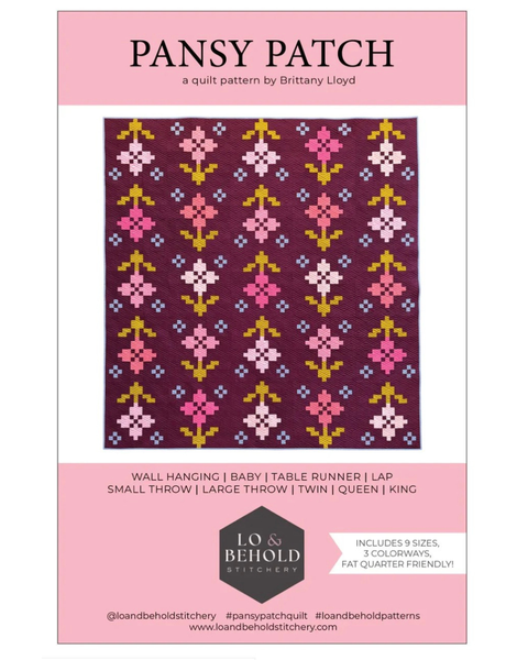 Pansy Patch quilt pattern by Lo & Behold Stitches with floral design on a pink background