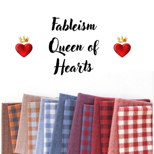 fourteen fat quarters of plain cotton fabric and gingham fabric with woven hearts