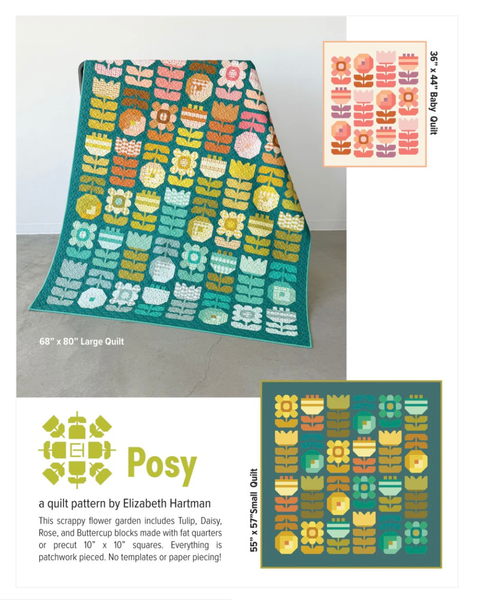 Colorful floral quilt with pattern details and branding on a plain background