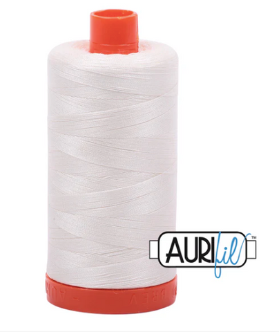 Spool of white thread with red ends and Aurifil logo on a white background