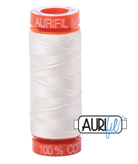 Spool of white thread with red accents and Aurifil branding on a white background