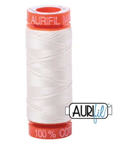 Spool of white thread with red accents and Aurifil branding on a white background