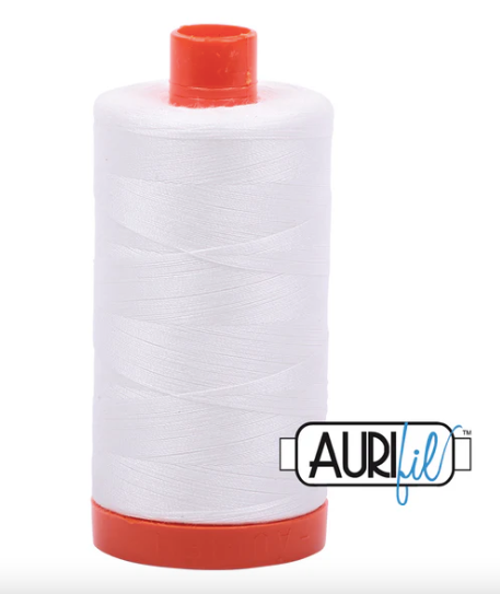 Spool of white thread with red ends and Aurifil logo on a white background
