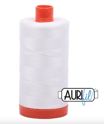 Spool of white thread with red ends and Aurifil logo on a white background