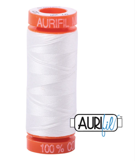 Aurifil thread spool with white thread and orange label on a white background
