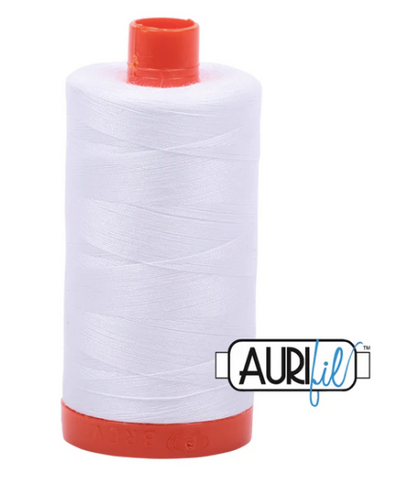 Spool of white thread with red ends and Aurifil logo on a white background