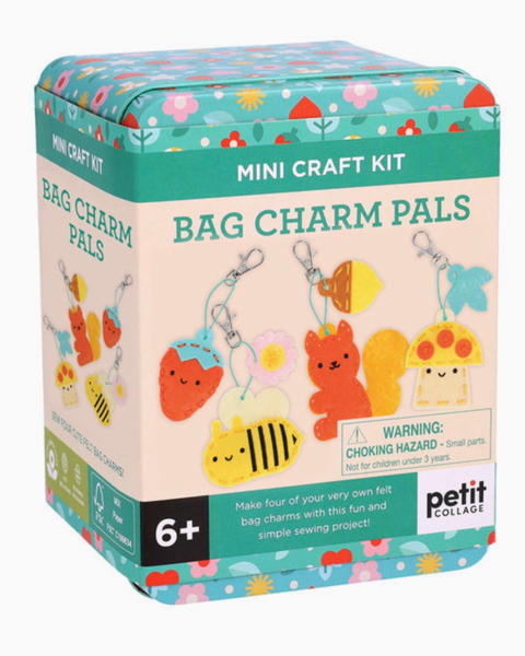 Petit Collage Bag Charm Pals Mini Craft Kit in a decorative tin box, showing colorful felt bag charms and a warning label on the front.