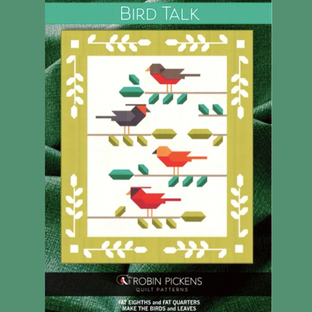 Quilt pattern design with birds and leaves on a green background
