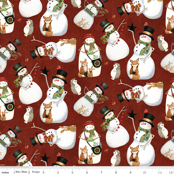 Pattern of snowmen and forest animals on a red background with a ruler at the bottom.
