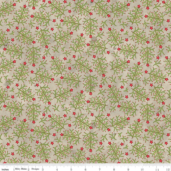 Fabric with a pattern of green leaves and red stars on a beige background