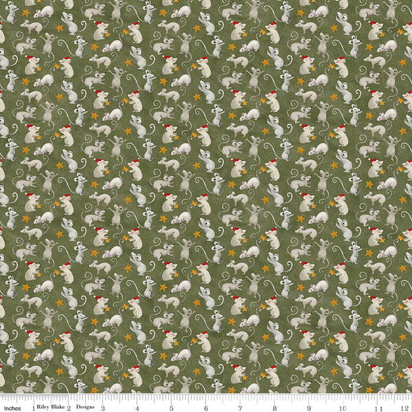 Pattern of small animals with red hats on a green background with a fabric yardstick at the bottom.