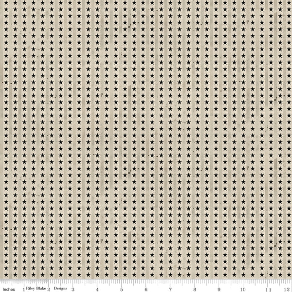 Fabric with small star pattern on a beige background