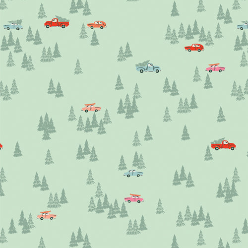 Cars and trucks in a forest of evergreens, with a Christmas tree o their roof.  Mint green quilting cotton