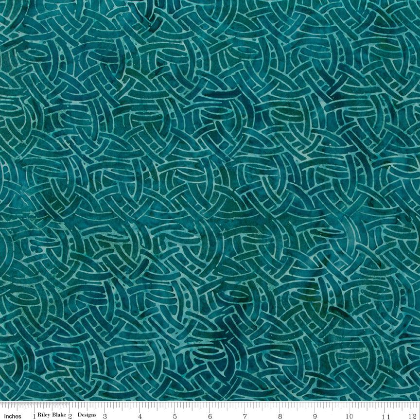 Teal fabric with wavy pattern, brand 'Riley Blake' visible