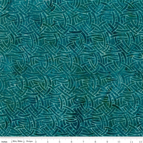 Teal fabric with wavy pattern, brand 'Riley Blake' visible