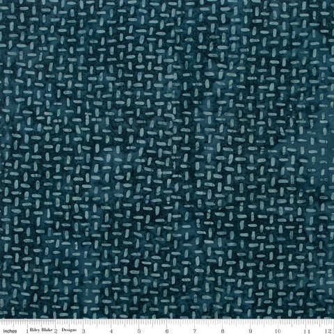 Textured blue fabric pattern with a ruler at the bottom for scale.