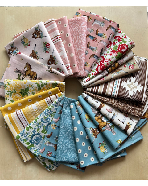 Twenty-one fat quarters from the Cowgirl collection.