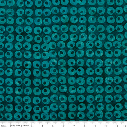 Teal fabric with circular pattern on a blue background