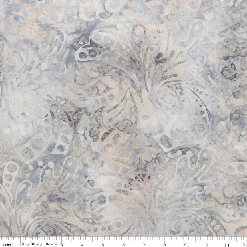 Patterned fabric with intricate design in neutral colors on a white background