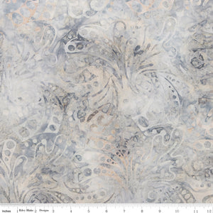 Patterned fabric with intricate design in neutral colors on a white background