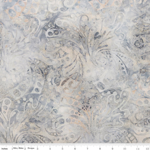 Patterned fabric with intricate design in neutral colors on a white background