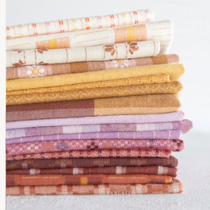 Stack of fat quarters in various earthy tones