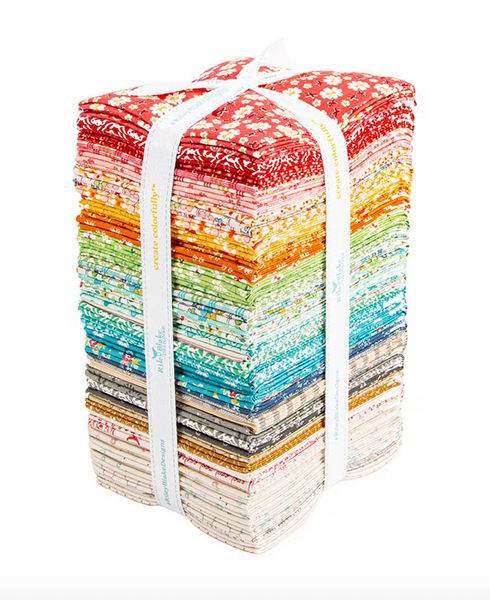 Stack of colorful fabric bundles tied together on a white background
