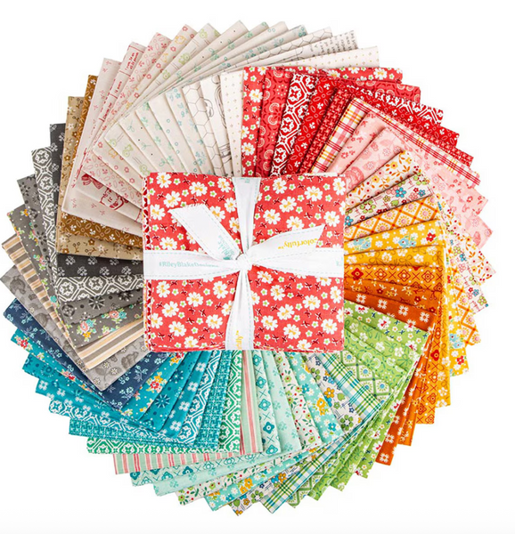 Collection of colorful fabric swatches with a central bow on a white background