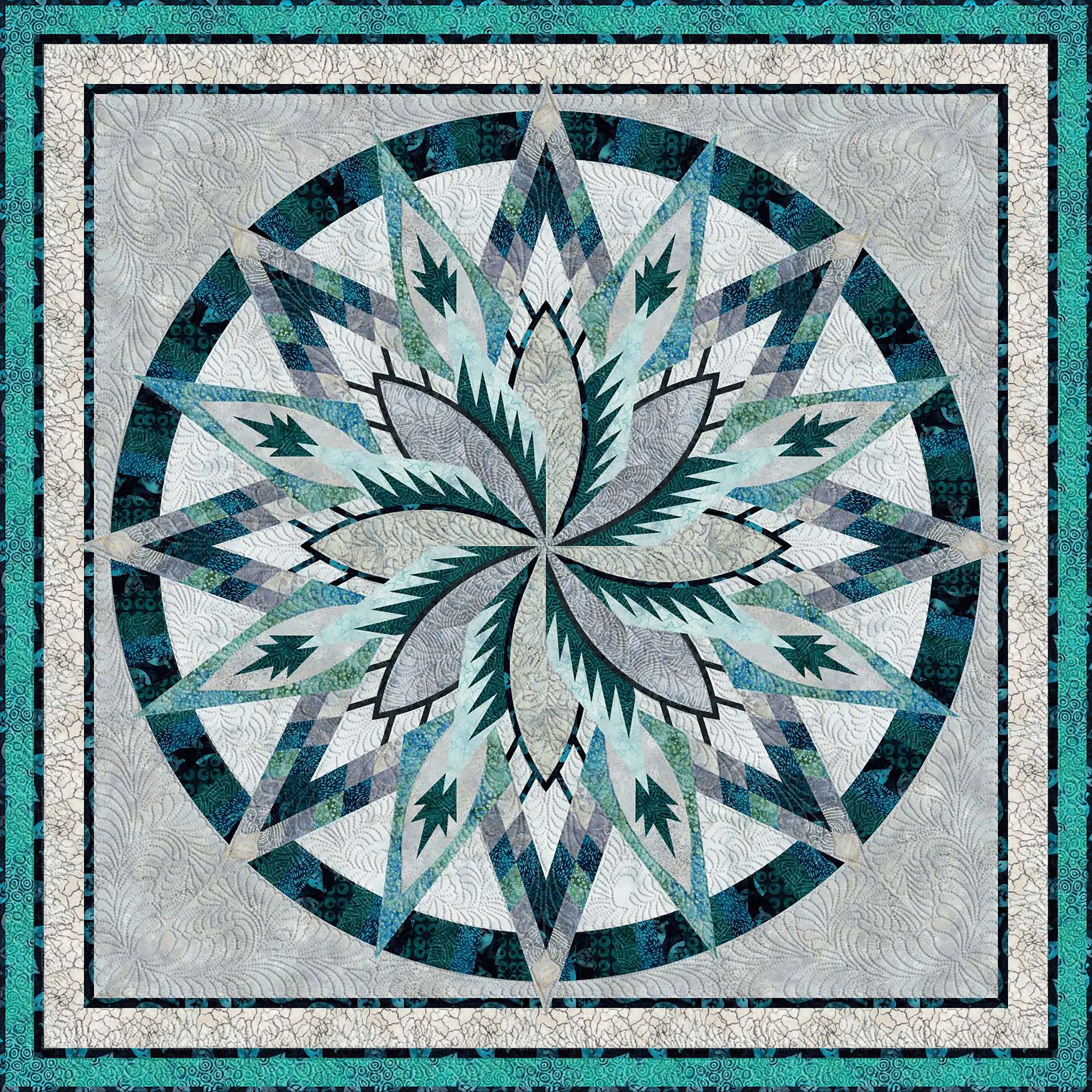 Large star shaped quilt in assorted shades of blue, green and gray