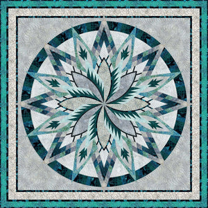 Large star shaped quilt in assorted shades of blue, green and gray
