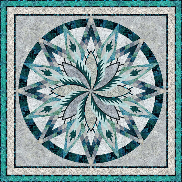 Large star shaped quilt in assorted shades of blue, green and gray