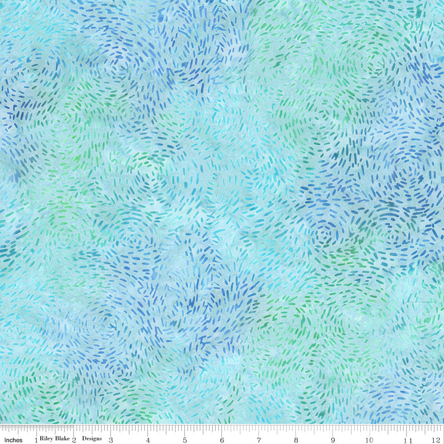 Fabric with a swirling pattern of blue and green on a light blue background