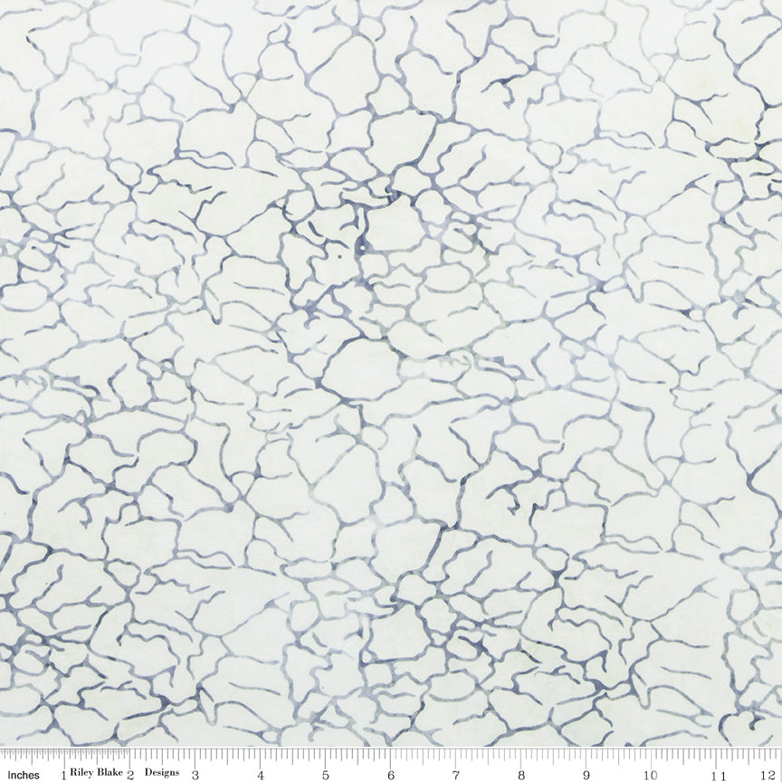White fabric with blue cracked pattern, measurement scale at the bottom