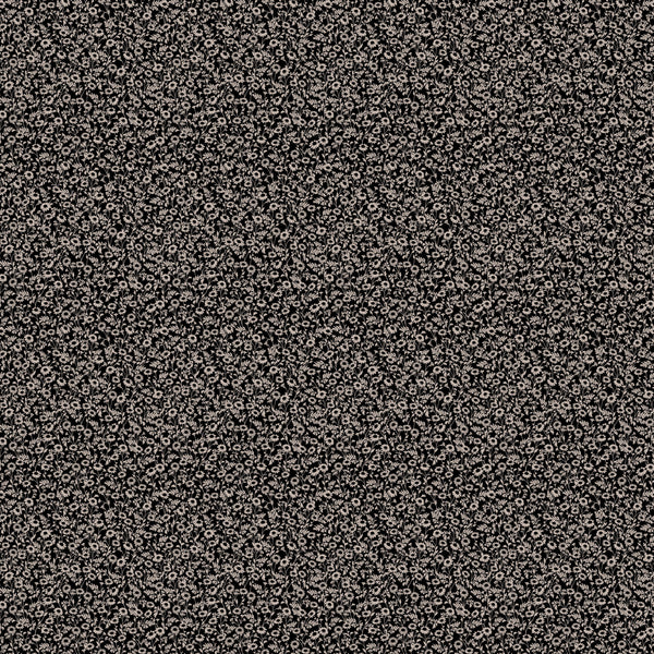 Black and white floral pattern on a textured fabric background