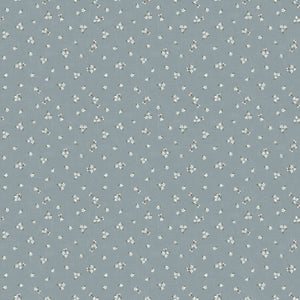 Pattern of small white flowers on a blue background