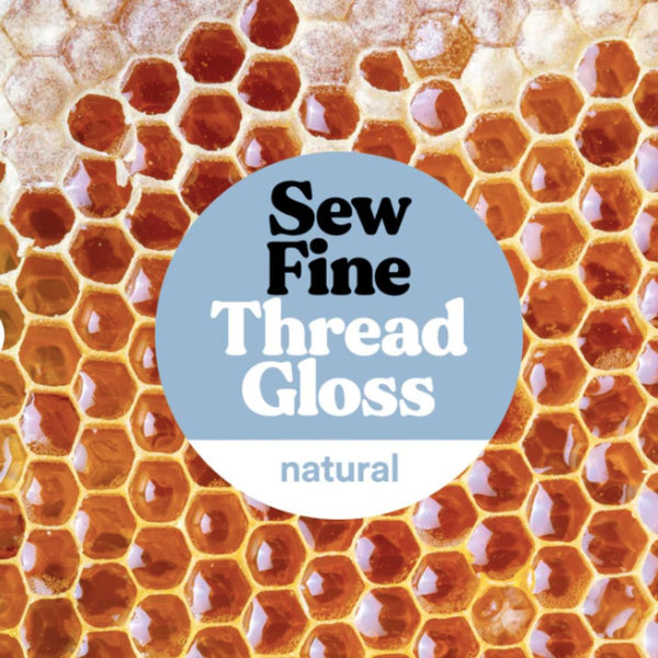 Honeycomb pattern with 'Sew Fine Thread Gloss' label on a blue circle