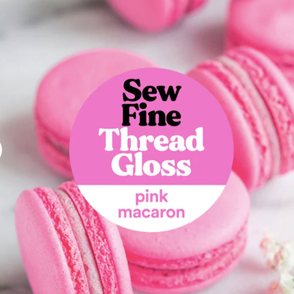 Pink macaron with 'Sew Fine Thread Gloss' label on a white background