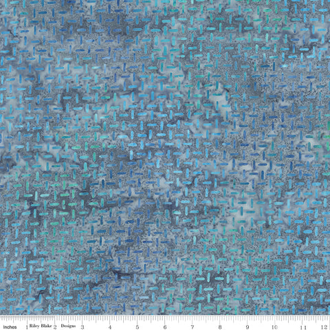 Blue textured fabric pattern with a ruler at the bottom