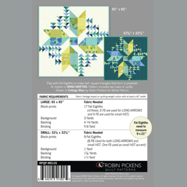Quilt pattern packaging with fabric requirements and design on a gray background