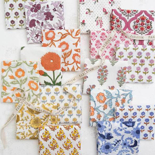 Collection of floral patterned fabric swatches on a white background