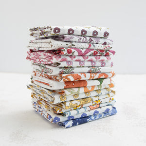 stack of folded printed fabrics
